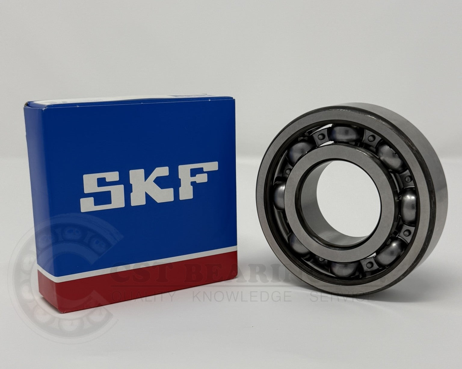 SKF bearing and its packaging on a white background